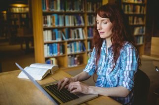 Mature student studying in library at the university